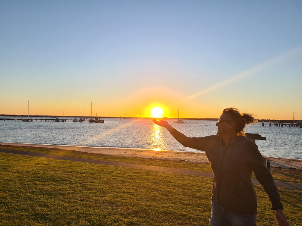 Photo of Sharon holding the sunset at Port Denison